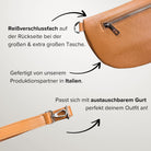 Cognacfarbene MAONI-Bauchtasche mit sichtbarem Rückseiten-Reißverschluss und angeschnittenem Ledergurt – Bild zeigt Details zur Produktion in Italien und Gurtwechsel-Möglichkeit